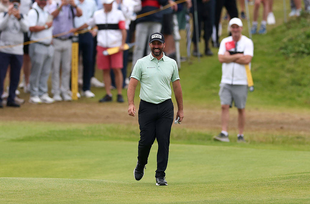 John Parry is all smiles after landing a hole-in-one at The Open, on the 13th at Royal Portrush in 2025